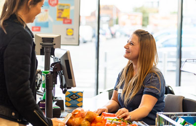 Lidl staff and customer